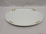 Travessa oval grande em porcelana Steatita floral com friso ouro. Medindo 37cm x 24,5cm.