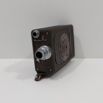 Antiga Filmadora 16 mm, Marca Bell & Howell, Não testado o funcionamento.  Medidas: Altura: 10 cm, Largura: 5 cm, Comprimento: 17,5 cm, Peso: 1100 g.