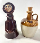 DUAS GARRADFAS EM CERÂMICA SENDO UMA DELAS NA FORMA DE FRADE, POSSUI TAMPA COM RACHADURA E EMPERRADA. MEDIDAS:a