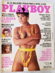 Revista Playboy Brasil nº 125  Cláudia Egito (Dezembro de 1985)Playboy Brasil, nº 125, publicada em dezembro de 1985. A capa apresenta Cláudia Egito, eleita a "Primeira Musa do Verão 86", em um ensaio que define a estética solar e vibrante da época.Inclui o lendário pôster de Madonna nua, um dos itens mais cobiçados por colecionadores da Rainha do Pop em todo o mundo. Traz também a cobertura exclusiva do filho de Ronald Reagan em Moscou.