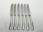 Jogo de 6 facas de sobremesa em aço inox Wolff. Medindo 21,5cm de comprimento.