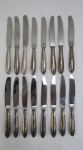 WOLFF 90- FAQUEIRO, Dezesseis (16) talheres, confeccionados em metal espessurado a prata com lâminas em aço, ornamentação fita cruzada, manufatura PRATA WOLFF 90 (tradição desde 1894), sendo: dezesseis facas de sobremesa ( 21 cm).
