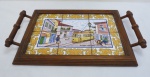 PORTUGAL- Bandeja em madeira com alças laterais torneadas, fundo decorado com painel de seis azulejos portugueses, paisagem de Rua de Alfama, pintados a mão. Assinado. Med. 45 x 27 cm entre alças.