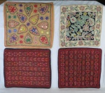 Quatro (04) capas de almofadas, sendo duas da Rússia nos tons vermelhos ( 48 x 41 cm, 43 x 41 cm) , uma indiana espelhada ( 45 x 45 cm) e uma portuguesa ( 40 x 40 cm).