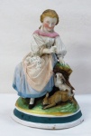 Uma escultura em biscuit europeu, representando " Jovem Camponesa e Coelhos" em rica policromia, Séc XIX.. Manufatura no verso. Med. 21 x 14 cm.
