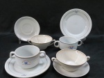 Dois (02) pares de consommé em porcelana branca, bordas douradas, um marcado American Club RJ, um par Barão do Rio Branco.