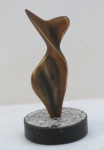 TONNY- Escultura feminina representando " Silhueta Feminina" em bronze, base redonda em granito. Med. 15 cm alt x 7,5 cm diâmetro.