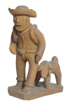 MANOEL VITALINO  - Arte popular, escultura em barro cozido representando ` homem nordestino com cachorro`; medindo 9 x 7,5 cm.