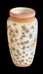 Vaso em faiança esmaltada, decorado com delicados motivos florais em policromia e acabamento craquelado. Medidas:  33,5 x 16 cm.