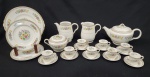 John Maddock & Sons, England. Conjunto em porcelana esmaltada na cor branca, decorado com motivos florais em policromia e filetes dourados. Composto por um bule com tampa, uma leiteira, uma jarra, um açucareiro com tampa, oito xícaras com seus respectivos dez pires, três pratos para sobremesa e um prato raso. Manufatura no verso. Observação: Conjunto com bicados, desgaste na douração, sinais de uso e marcas do tempo.