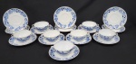 Steatita, Brasil. Sete xícaras para consummé com 7 pires em porcelana esmaltada, com decoração floral azul estilo cebolinha. Manufatura no verso. Uma xícara e um pires com bicado. Medem: 17 cm.