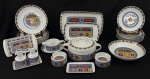 Schmidt, Brasil. Aparelho de jantar em porcelana esmaltada, decorado em policromia, composto por sete pratos rasos, nove pratos fundos, uma sopeira, uma saladeira, uma molheira, cinco travessas, dois porta-copos e 2 galheteiros. Manufatura no verso. 3 pratos raso, 3 pratos fundos e 1 travessa com bicados; 1 garrafinha com restauro.