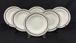 Limoges, France. Seis pratos fundos em porcelana francesa esmaltada, decorados com motivos florais em policromia e detalhes em ouro. Manufatura no verso. Medindo: 3,5 x 22,5 cm.