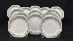 Schmidt, Brasil.  Treze pratos para sobremesa em porcelana esmaltada, em formato oitavado, decorado com motivos florais em policromia. Manufatura no verso. Medindo: 18 cm.
