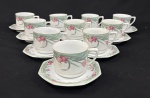 Schmidt, Brasil.  Dez xícaras para chá com 9 pires em porcelana esmaltada, em formato oitavado, decorado com motivos florais em policromia. Manufatura no verso.