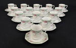 Schmidt, Brasil.  Quinze xícaras para café em porcelana esmaltada, em formato oitavado, decorado com motivos florais em policromia. Manufatura no verso.