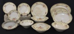 Johnson Bros, modelo "Pareek". Elegante e tradicional serviço de jantar em porcelana inglesa esmaltada, decoração floral policroma delicadamente distribuída sobre fundo marfim, com acabamento em filetes dourados. Composto de: 1 sopeira com tampa, 1 terrinterrina com tampa, 1 travessa redonda, 4 travessas ovais, 2 saladeiras, 17 pratos rasos, 12 pratos fundos, 11 pratos para sobremesa e 1 covilhete. Manufatura no verso. Med. maior travessa 37 x 28 cm, travessa redonda 32 cm diâm., pratos rasos 22 cm diâm., pratos fundos 3 x 22 cm, pratos para sobremesa 18 cm diâm. e covilhete 14 x 21 cm. Total de 50 peças. Apresentam manchas, craquelados e desgastes compatíveis com o tempo.