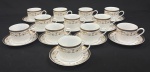 Porcelana Real, Brasil. Doze xícaras para chá com respectivos pires em porcelana branca vitrificada, decoração com faixa contínua em ouro e delicado motivo floral policromo, composto por guirlandas, flores e arabescos estilizados. Manufatura no verso