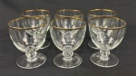 Seis cálices para vinho tinto em cristal europeu translúcido, com faixa em ouro. Medindo: 9,5 x 7,5 cm.