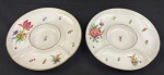 Steatita. Duas petisqueiras em porcelana esmaltada e policromada, com rica decoração floral e filetes em ouro. Com divisórias. Medindo: 23,5 cm.
