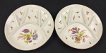 Steatita. Duas petisqueiras em porcelana esmaltada e policromada, com rica decoração floral e filetes em ouro. Com divisórias. Medindo: 22 cm .