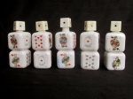 Cinco miniaturas de licor italianas, em porcelana, (cheias), uma tampa rachada. Medindo: 12cm de altura.