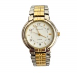 TECHNOS - Relógio de pulso Technos Luxor, vintage, anos 80. Mostrador branco com pulseira em metal cromado e dourado. Funcionando. Medida do visor 3,5cm.