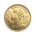 SUIÇA 1949 - Moeda estrangeira em ouro, modelo 20 Francos  Helvetia (Suíça), datada de 1949, apresentando no anverso busto feminino alegórico com inscrição HELVETIA e, no reverso, escudo suíço com ramos e inscrição 20 FR. Peso: 6,6 g.Peça clássica de numismática em ouro, muito procurada por colecionadores e investidores. Este item não se encontra na galeria, e sim em posse do proprietário.