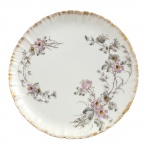 LIMOGES - Prato em pasta de porcelana francesa Haviland (marcas CFH/GDM  Limoges), com delicada decoração floral policromada e borda ondulada com filete dourado. Peça de estilo clássico, ideal para composição de aparelho ou coleção. Mede 19,5 cm.