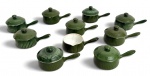 LIMOGES - Conjunto com 10 cremeiras no formato mini caçarolas em cerâmica esmaltada na cor verde sendo 9 peças com tampa e 1 sem tampa. Produção francesa, marca Aluminites Frugier  Limoges France, apresentando corpo canelado e design elegante. Peças decorativas e utilitárias, ideais para serviço individual. Pequenos sinais de uso compatíveis com a idade, bicado e fio de cabelo. Mede 10 cm.