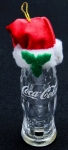 Colecionismo - Garrafa contour CocaCola em vidro miniatura ( h= 10cm) caracterizada para o Natal com gorro - Embalgem protetora intacta - made in China - Distributed by Cavanagh - California USA