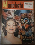 Revista Manchete Nº 149 - 26 de Fevereiro de 1955  Um item de altíssimo interesse para colecionadores, com foco na cobertura cultural do Carnaval daquele ano e na política paulista. Capa: Apresenta desgaste natural nas bordas e cantos, com o escurecimento característico do papel pelo tempo.Detalhes: Retorna ao padrão clássico do lote, exibindo as anotações e assinaturas à caneta no canto superior direito (sobre o logotipo da Manchete).