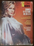 Revista Manchete Nº 684 (29 de Maio de 1965) - Ursula Andress / Festival de Cannes / Segunda Guerra -  Um exemplar riquíssimo em conteúdo que une o glamour do cinema europeu dos anos 60 com grandes reportagens sobre ciência astronômica, história militar e patrimônio nacional. Capa: Apresenta excelente nitidez de cores no retrato principal. Há marcas naturais do tempo e pequenos pontos de desgaste por fricção na extremidade esquerda (perfil da lombada). Contém as habituais anotações de arquivo à caneta e um carimbo de data ("29-5-65") no canto superior direito.
