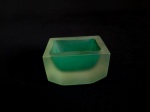 Cinzeiro confeccionado em bloco de vidro satine, com parte interna , na cor verde. Med.: 5,5 x 6,5 x 9 cm.