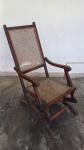 Cadeira de balanço no estilo império com assento e encosto em palhinha. Med: 108 x 53 x 80. OBS: No estado. Retirada em Santa Teresa, mediante agendamento.