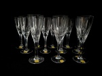 HERING - Conjunto com 12 fluts, confeccionados em cristal translucido, lapidadas no padrão dedão. Med.: 20 cm.