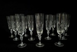 STRAUSS - H. STERN - Conjunto com 12 fluts em cristal translucido, lapidação no padrão losango. Med.: 20 cm.Obs: 1 apresenta bicado.