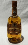 Bebida - Whisky escocês Grand Macnish, blended Scotch whisky, acondicionado em garrafa original de 1 litro, teor alcoólico de 43%. Produzido e engarrafado na Escócia pela Robert Macnish & Co., mantendo selo fiscal e rótulos originais. Conteúdo não atestado.