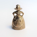 Sineta de mesa em bronze representando camponesa holandesa medindo 7 cm. 