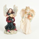 ESCULTURAS, duas (2) distintas representando anjos, confeccionadas em resina policromada, medindo em media 13 cm altura, uma delas com selo da KS Collection, modelo Angelic Harmony, vide foto.