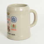 LOUÇA  ALEMÃ, uma (1) caneca de cerveja com propaganda da DORTMUNDER KRONEN (tradição desde 1729), marca de origem em cavo no fundo W. GERMANY (Alemanha Comunista), medindo 13 cm altura, ideal para coleção de bar, vide foto.
