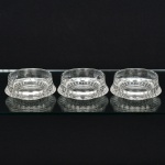 CRISTAL, três (3) taças para sobremesa, grossas, incolores e translúcidas, moldadas em folhas estilizadas na base,medindo 12 cm diâmetro e 5 cm altura, uma delas com selo da H. STERN, vide foto.