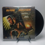 BLADE RUNNER  - Estado de conservação: CAPA- B e MÍDIA - MB.. ATENÇÃO! Produto sendo vendido no estado conforme fotos. N(Novo) / MB(Muito Bom) / B(Bom) / M(Mediano) / R(Ruim). LPs podem ter pequenos riscos superficiais q possam causar chiados. Se necessário, solicitar mais fotos, vídeos ou perguntas para análise via e-mail contato.antig@gmail.com. Questione todas suas dúvidas antes de efetuar os lances, eles são IRREVOGÁVEIS e IRRETRATÁVEIS! Leia os Termos e Condições e a caixa de informações do leilão em Home no site www.antig.com.br dando ênfase nas Informações Importantes, ao efetuar o lance o arrematante concorda com Datas, Prazos e Regras da casa de leilões Antig.