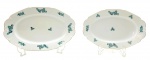EPIAG CZECHOSLOVAKIA - 02 travessas ovais decoradas com filetes dourados e padrões vegetalistas em tons de verde; em porcelana da antiga Tchecoslováquia. Numeradas na base. Medidas: 35 x 24 cm; 31 x 21 cm.