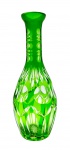 Vaso em cristal double na cor verde, com corpo ovalado, lapidado com elementos ovais e elípticos. Medidas: 27 x 10 cm. Com ínfimo bicado na borda.