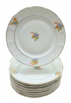 BARÃO DO RIO BRANCO - Parte de serviço de jantar composto por 09 pratos de sobremesa, decorados com coloridos buquês de flores e filetes dourados. Medidas: 19 cm (diâm.).