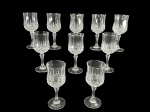 CRISTAIS, dez (10) taças para vinho confeccionadas em cristal translucido com lapidação de caneluras e bico de jaca, haste facetada, apoiada sobre base circular, medindo 16,5x6,5cm.