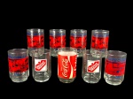 VIDROS, nove (9) copos para água confeccionados em vidro translucido, com estampas publicitárias das marcas Pepsi Copa 86, Guaraná Brahma e Coca-Cola, em modelos variados, medindo 12,5x7cm e 11,5x7cm.
