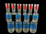VIDROS, lote com quatorze (14) peças, sendo: A) 6 tulipas para chopp confeccionadas em vidro translucido com decoração de embarcação na cor vermelha, medindo 16x6,5cm e B) 8 copos para água com decoração de saxofone e partituras musicais com logo da PEPSI na cor azul, medindo 11,5x7cm.