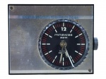 RELÓGIO, um (1) relógio despertador de mesa/viagem TYPHOS miniswiss alarm, Swiss Made, caixa retangular em metal escovado prateado com bordas escuras, mostrador circular preto com marcação em branco e vermelho, função alarme e chave liga/desliga na parte posterior. Peça com sinais de uso, riscos, manchas, não testado e sem garantia de funcionamento, acondicionado em estojo original, medindo 4x5cm.